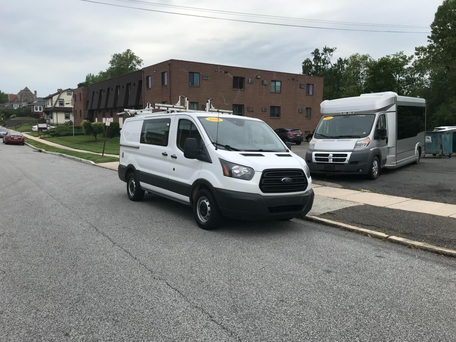 2018 White /Gray Ford Transit 150 (1FTYE1YM1JK) with an 3.7 V6 engine, Automatic transmission, located at 577 Chester Pike, Prospect Park, PA, 19076, (610) 237-1015, 39.886154, -75.302338 - 2018 Ford Transit 150: Dual drop down ladder racks, multiple pieces of shelving, power inverter w/ outlet, heavy duty partition, FLEET MAINTAINED, runs LIKE NEW! This vehicle comes inspected and has been given a bumper to bumper safety check. It is very clean, reliable, and well maintained. We of - Photo #1